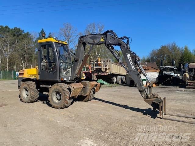 Mecalac 12 M TX حفارات بعجل
