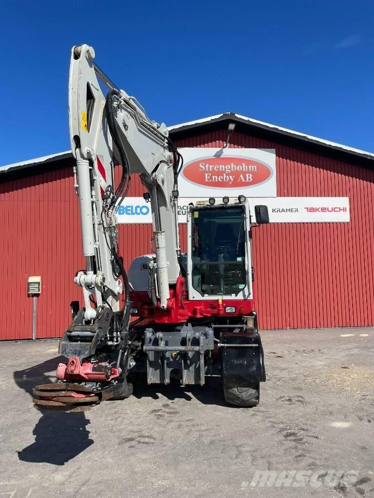 Takeuchi TB 295 W حفارات بعجل