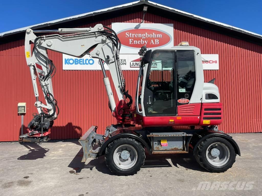 Takeuchi TB 295 W حفارات بعجل