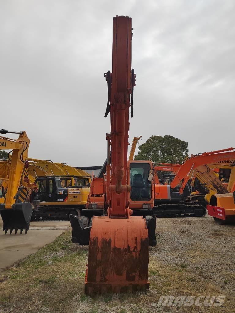 Doosan DH 210 W-7 حفارات بعجل