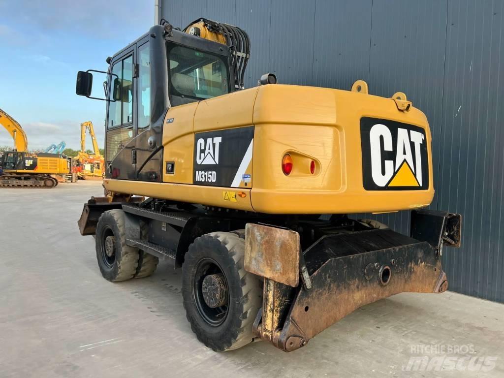 CAT M315D حفارات بعجل