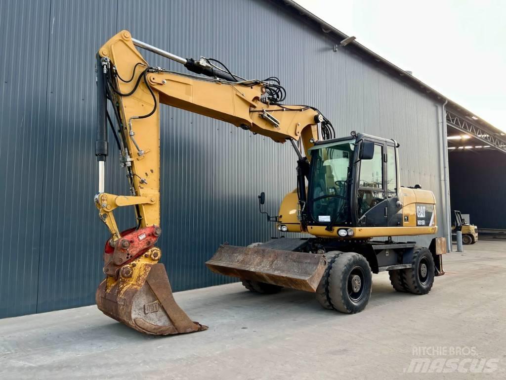 CAT M315D حفارات بعجل