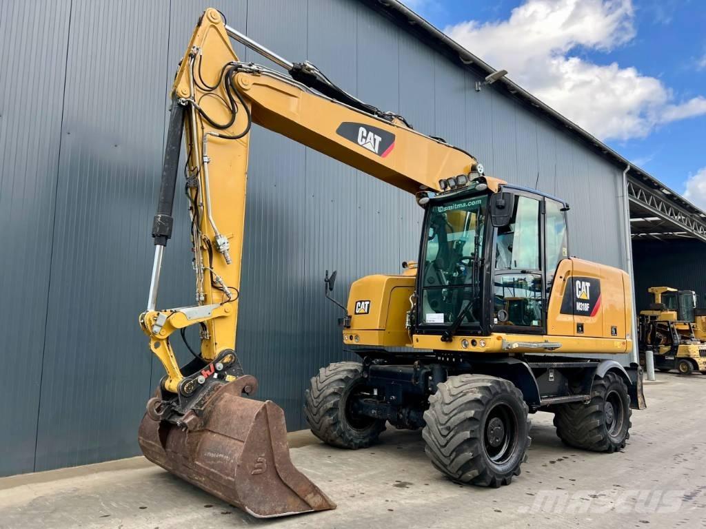 CAT M318F حفارات بعجل