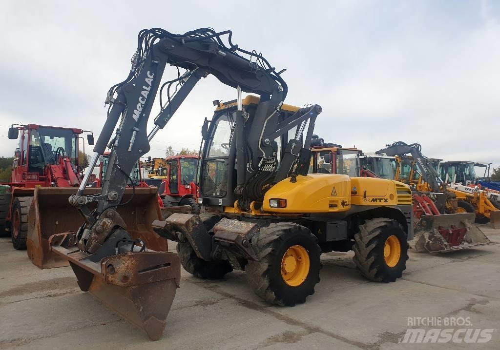 Mecalac 12 M TX حفارات بعجل