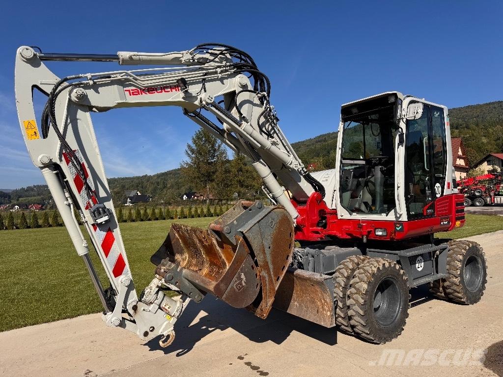Takeuchi TB 295 W حفارات بعجل