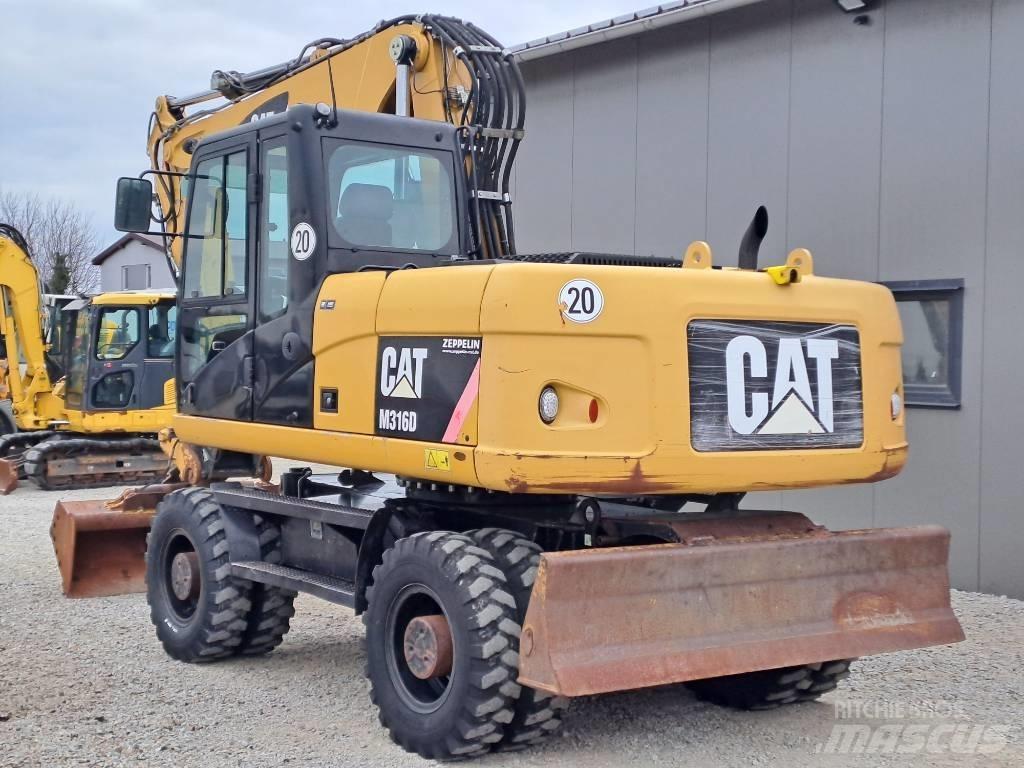 CAT M 316 D حفارات بعجل