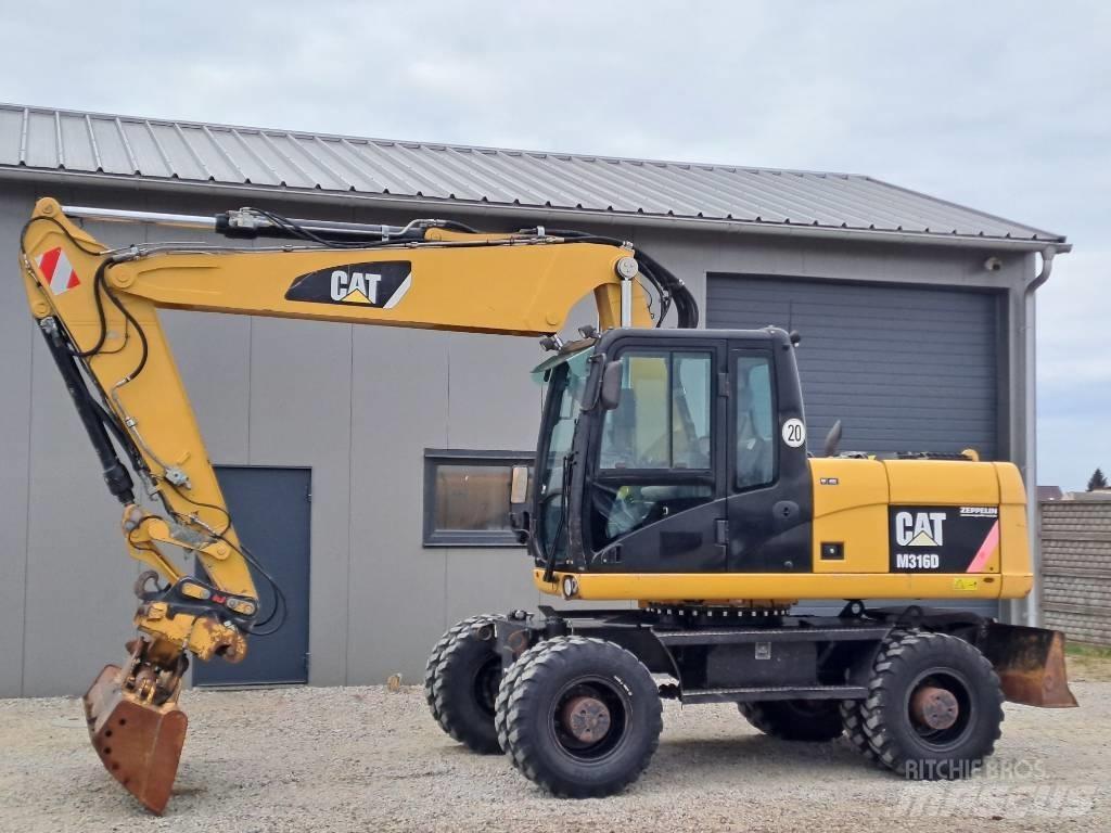 CAT M 316 D حفارات بعجل