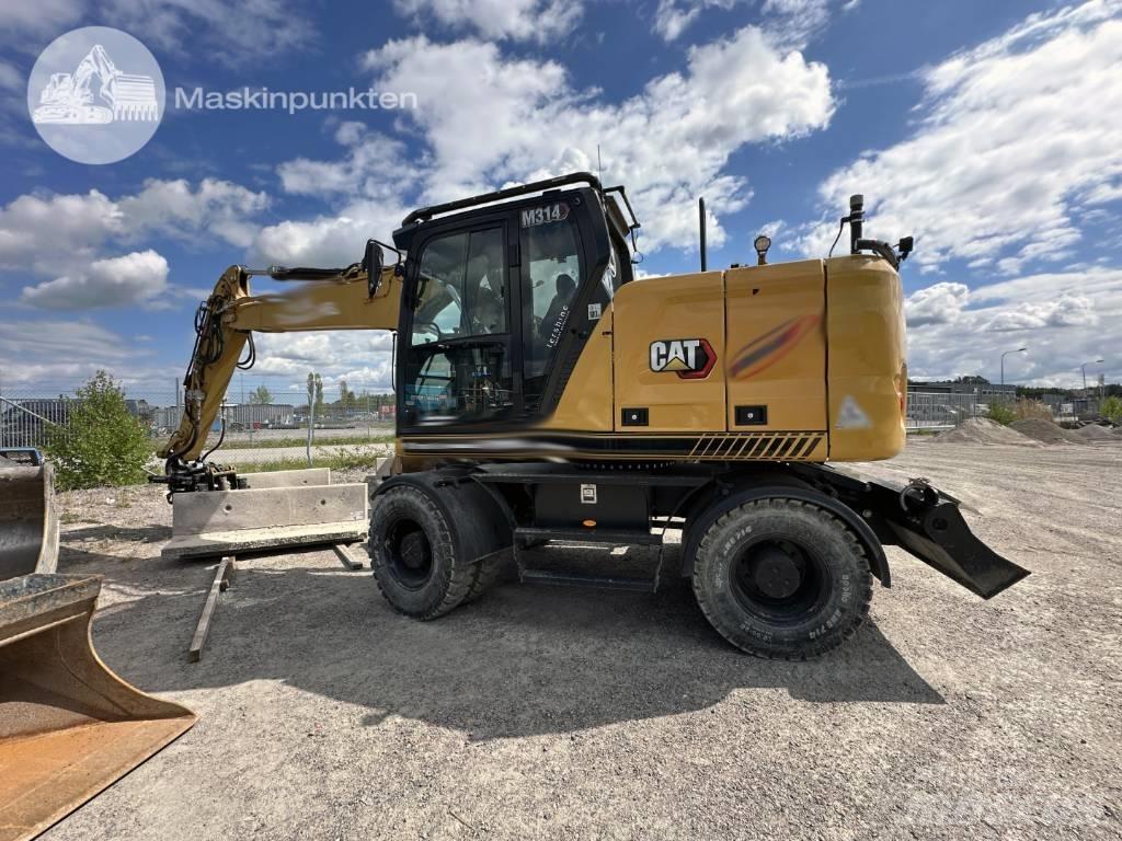 CAT M 314 حفارات بعجل