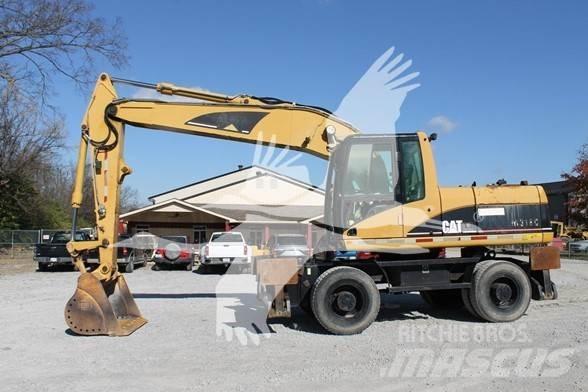 CAT M318C حفارات بعجل