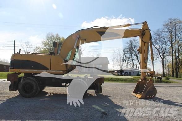 CAT M318C حفارات بعجل