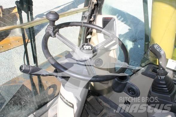 CAT M318C حفارات بعجل
