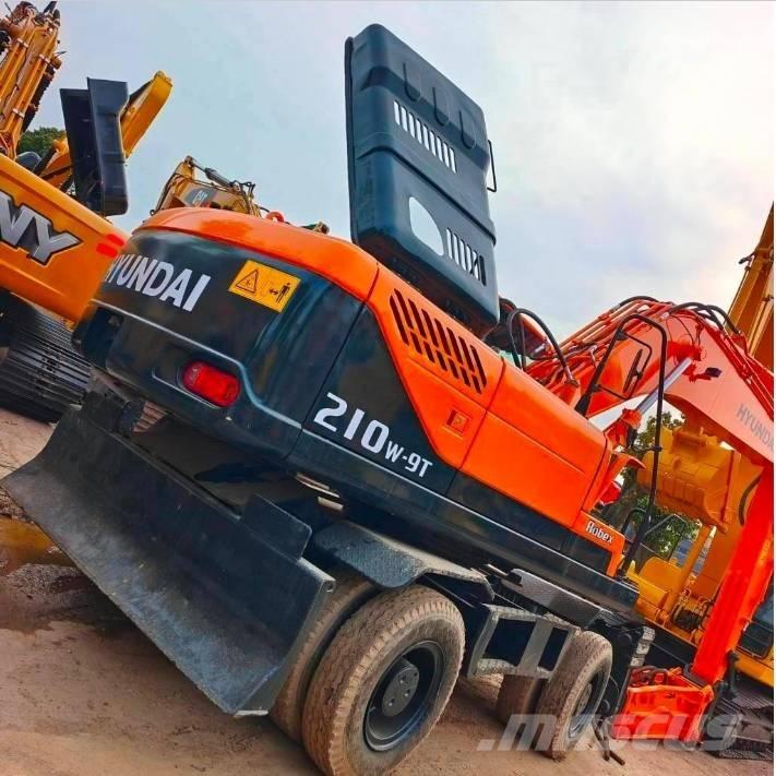 Hyundai 210 W-9 حفارات بعجل