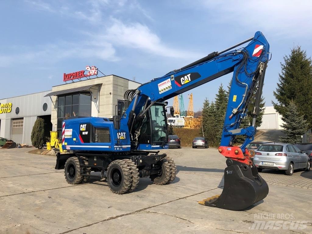 CAT M 318 F حفارات بعجل