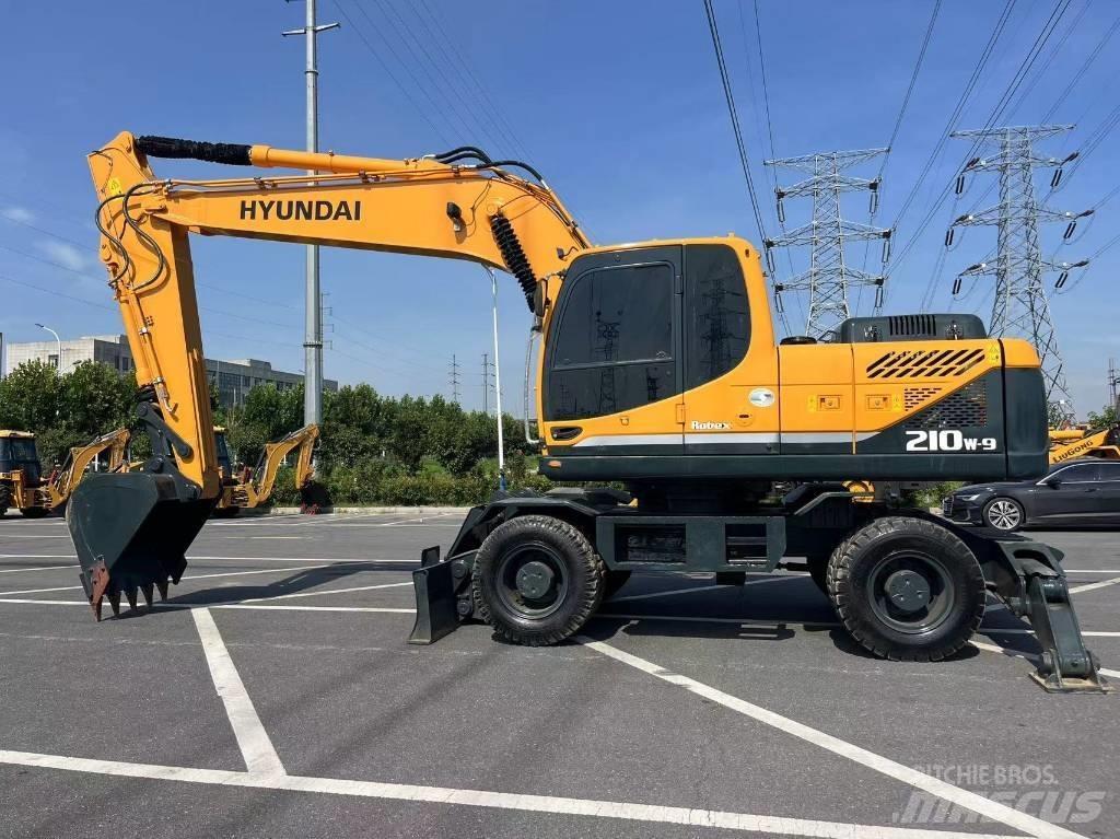 Hyundai 210W-9 حفارات بعجل