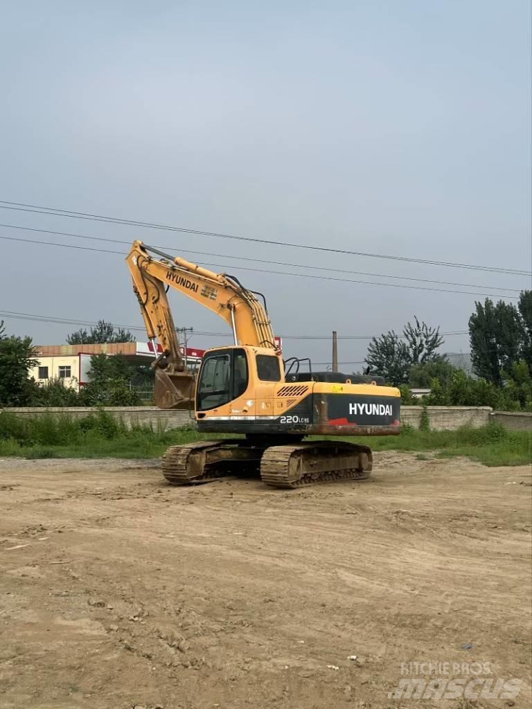 Hyundai R220-9S حفارات زحافة