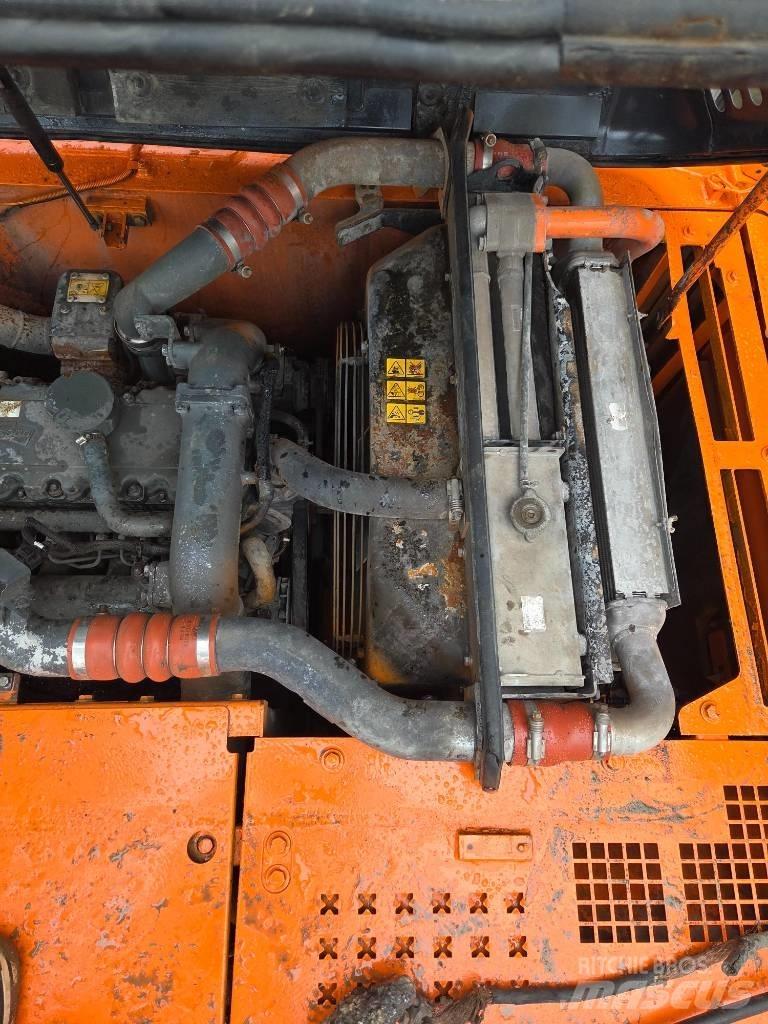 Doosan DX 210 W حفارات بعجل