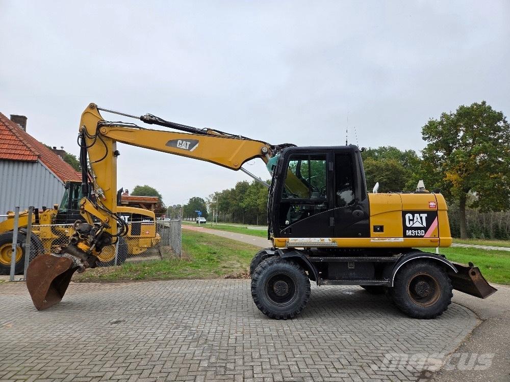 CAT M313D حفارات بعجل