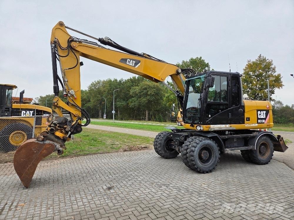 CAT M313D حفارات بعجل