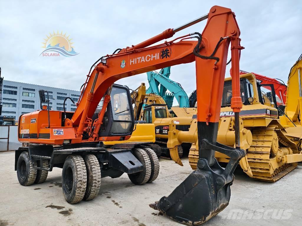 Hitachi EX 100 W D حفارات بعجل