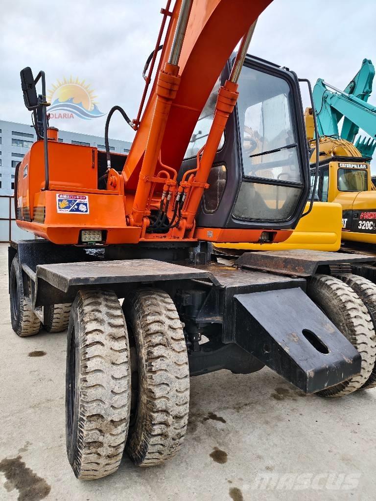 Hitachi EX 100 W D حفارات بعجل