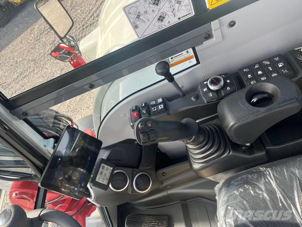Takeuchi TB 395 W حفارات بعجل