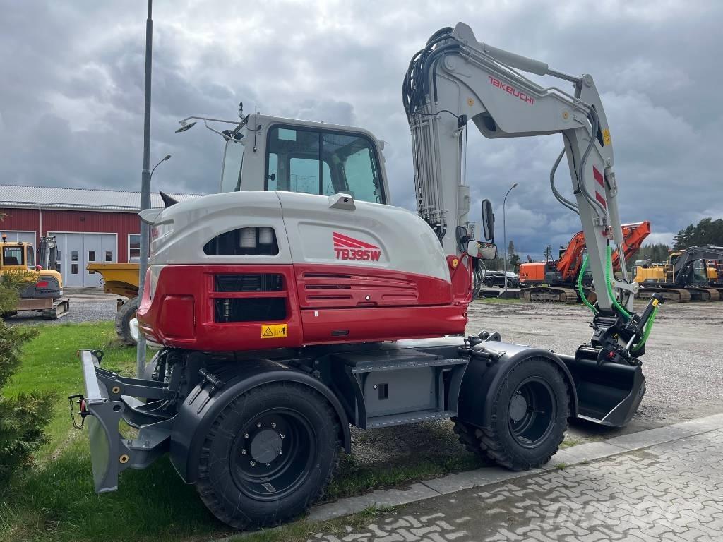 Takeuchi TB 395 W حفارات بعجل