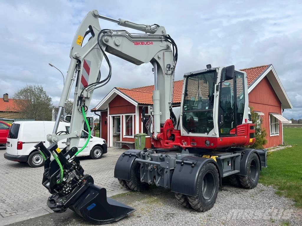 Takeuchi TB 395 W حفارات بعجل