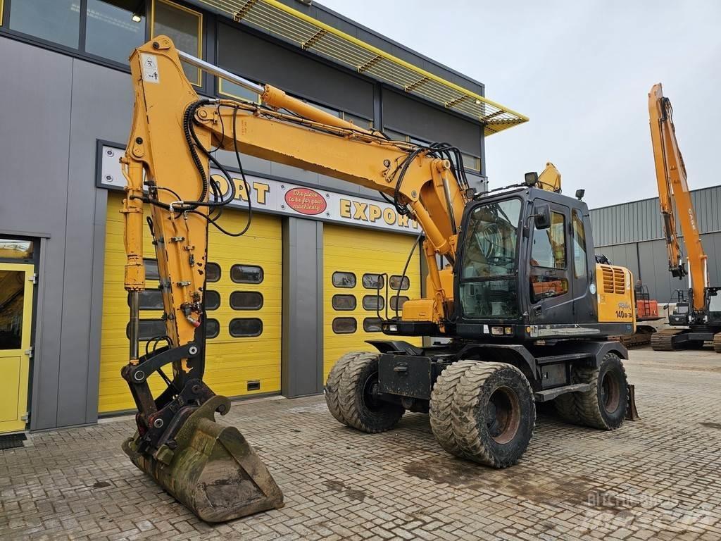 Hyundai R140W-7A حفارات بعجل