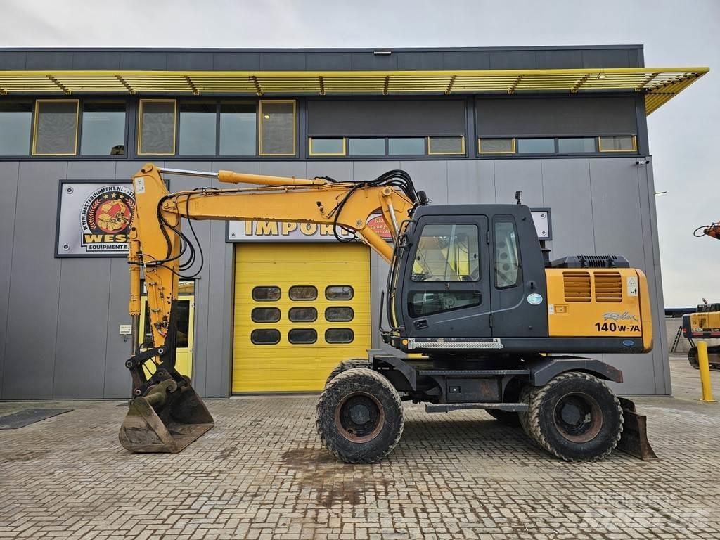 Hyundai R140W-7A حفارات بعجل