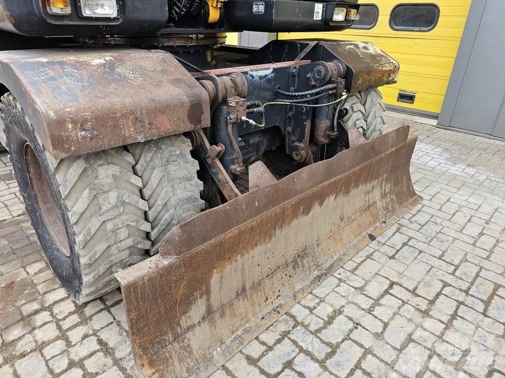 Hyundai R140W-7A حفارات بعجل