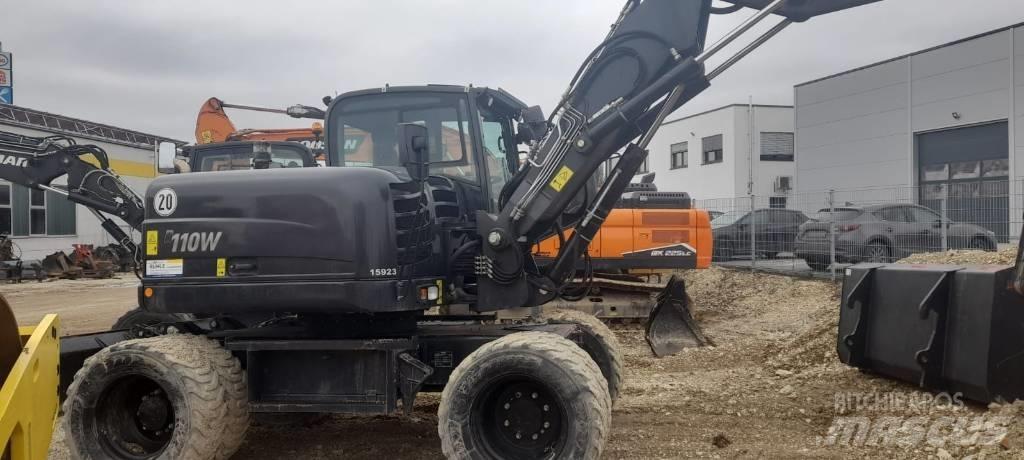 Yanmar B 110 W حفارات بعجل
