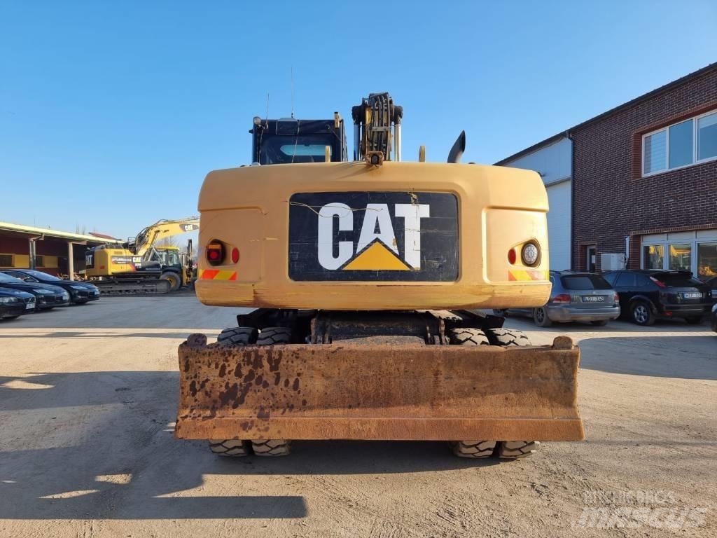 CAT M 316 D II حفارات بعجل