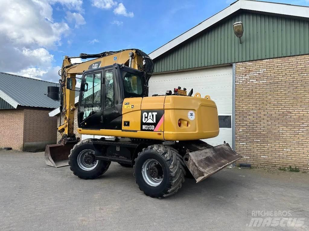 CAT M313D حفارات بعجل
