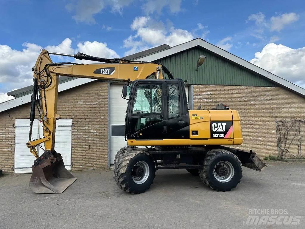 CAT M313D حفارات بعجل