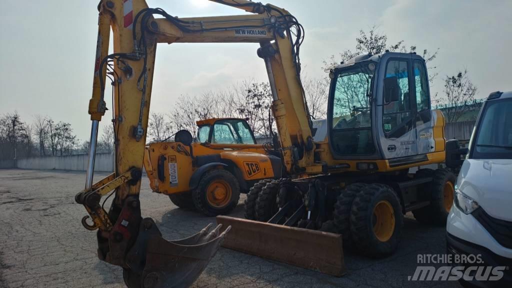 New Holland MH 3.6 حفارات بعجل
