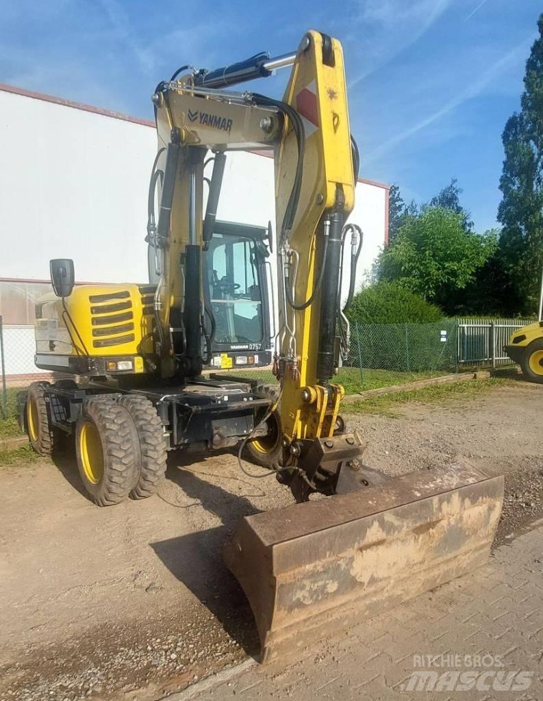 Yanmar B 110 W حفارات بعجل