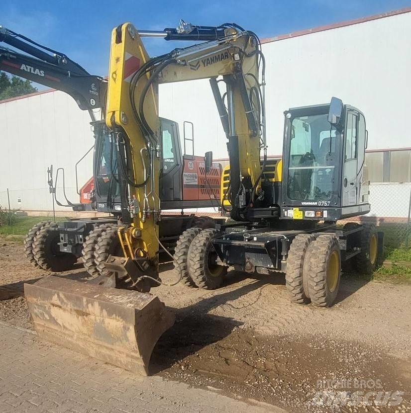 Yanmar B 110 W حفارات بعجل