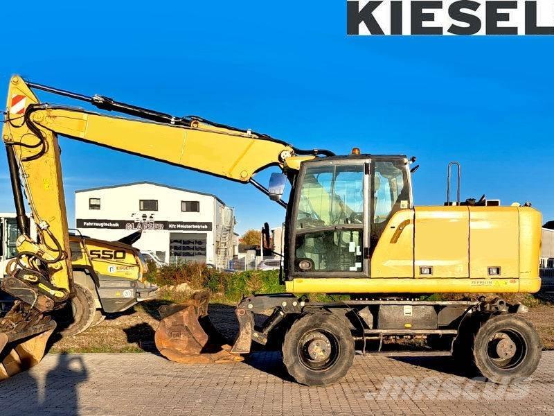 CAT M 318 F حفارات بعجل