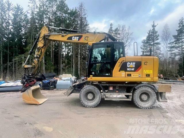 CAT M 314 F حفارات بعجل