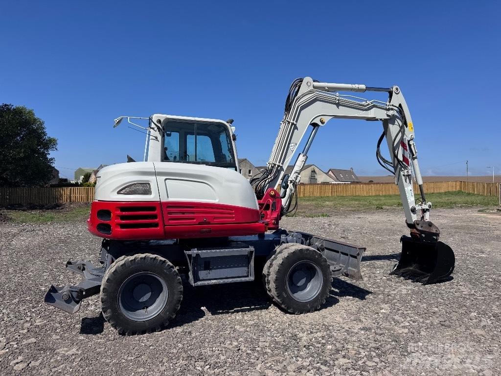 Takeuchi TB 295 W حفارات بعجل