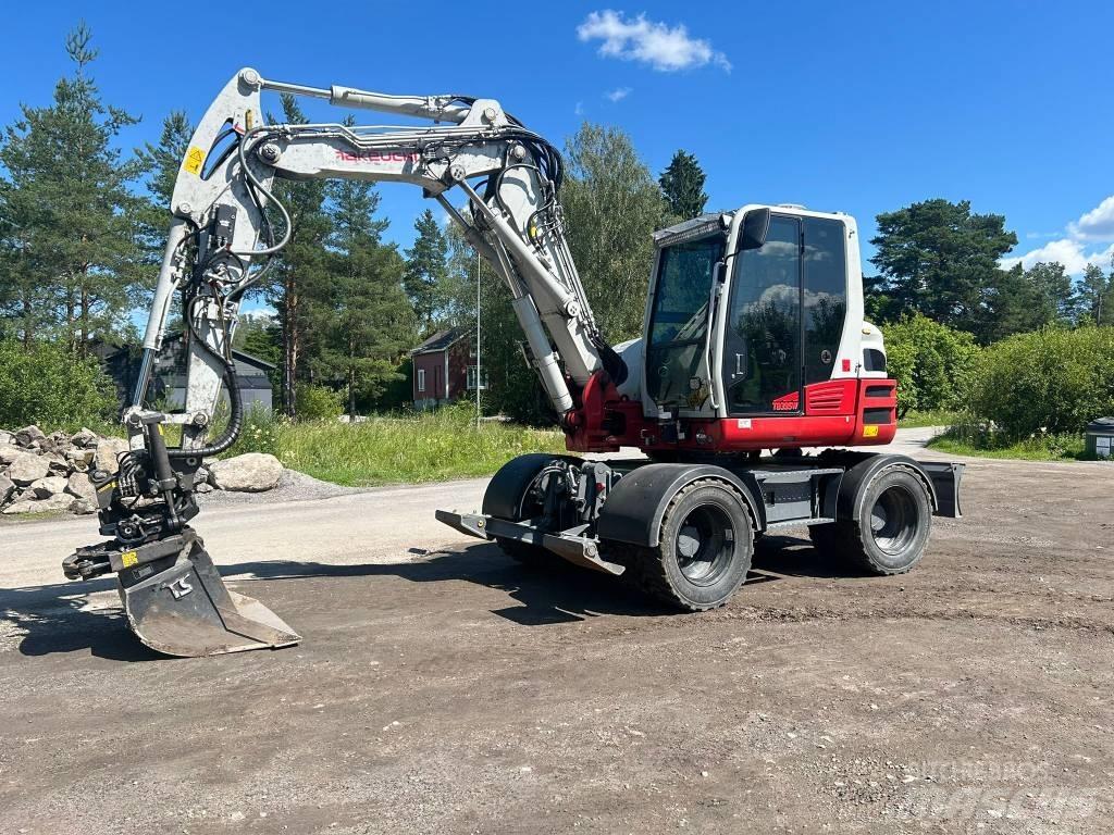 Takeuchi 395W حفارات بعجل