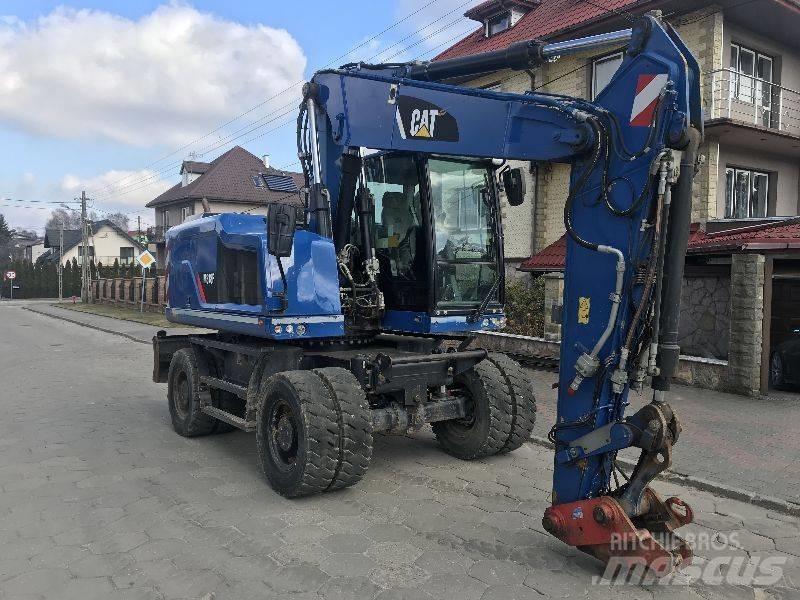 CAT M318f 318 f حفارات بعجل