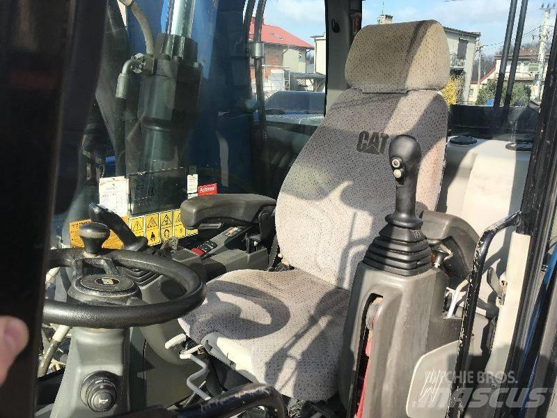 CAT M318f 318 f حفارات بعجل