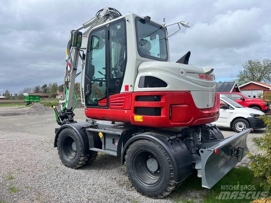 Takeuchi TB 395 W حفارات بعجل
