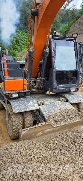Doosan D 140W-5 حفارات بعجل