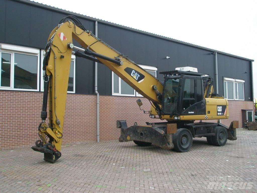 CAT M318D حفارات بعجل