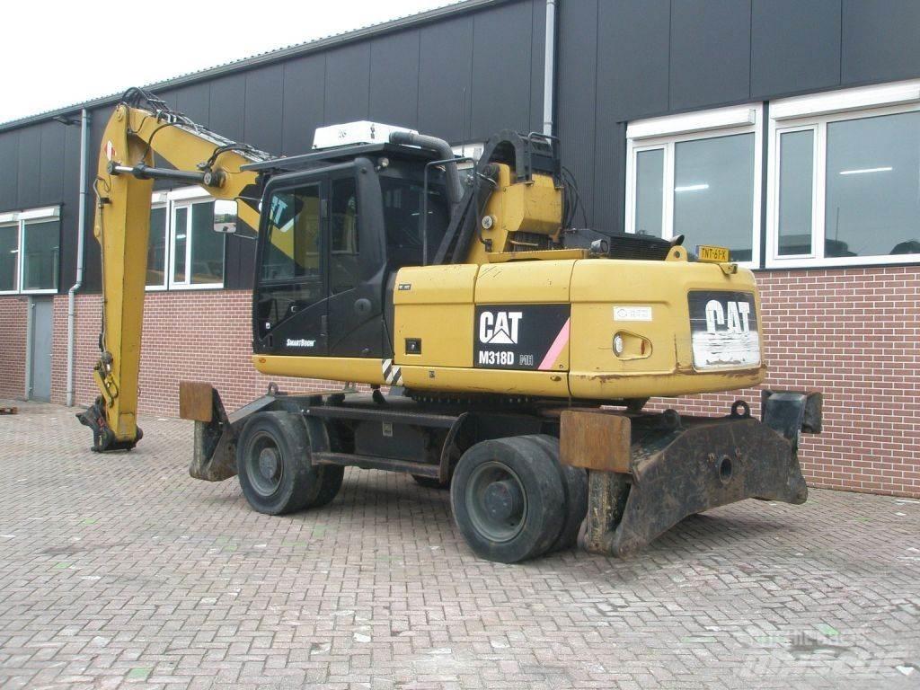 CAT M318D حفارات بعجل