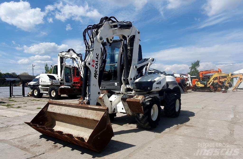 Mecalac 12 M TX حفارات بعجل