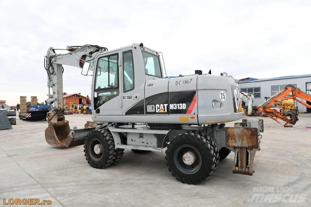 CAT M 313 D حفارات بعجل