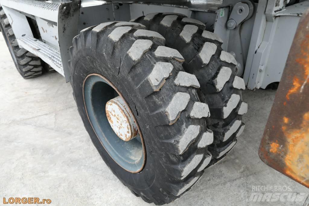 CAT M 313 D حفارات بعجل